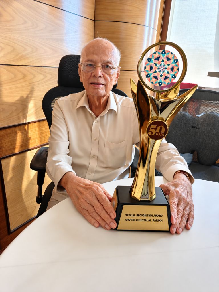 Shri Arvind Chhotalal Parikh holding GJEPC Special Recognition Trophy
